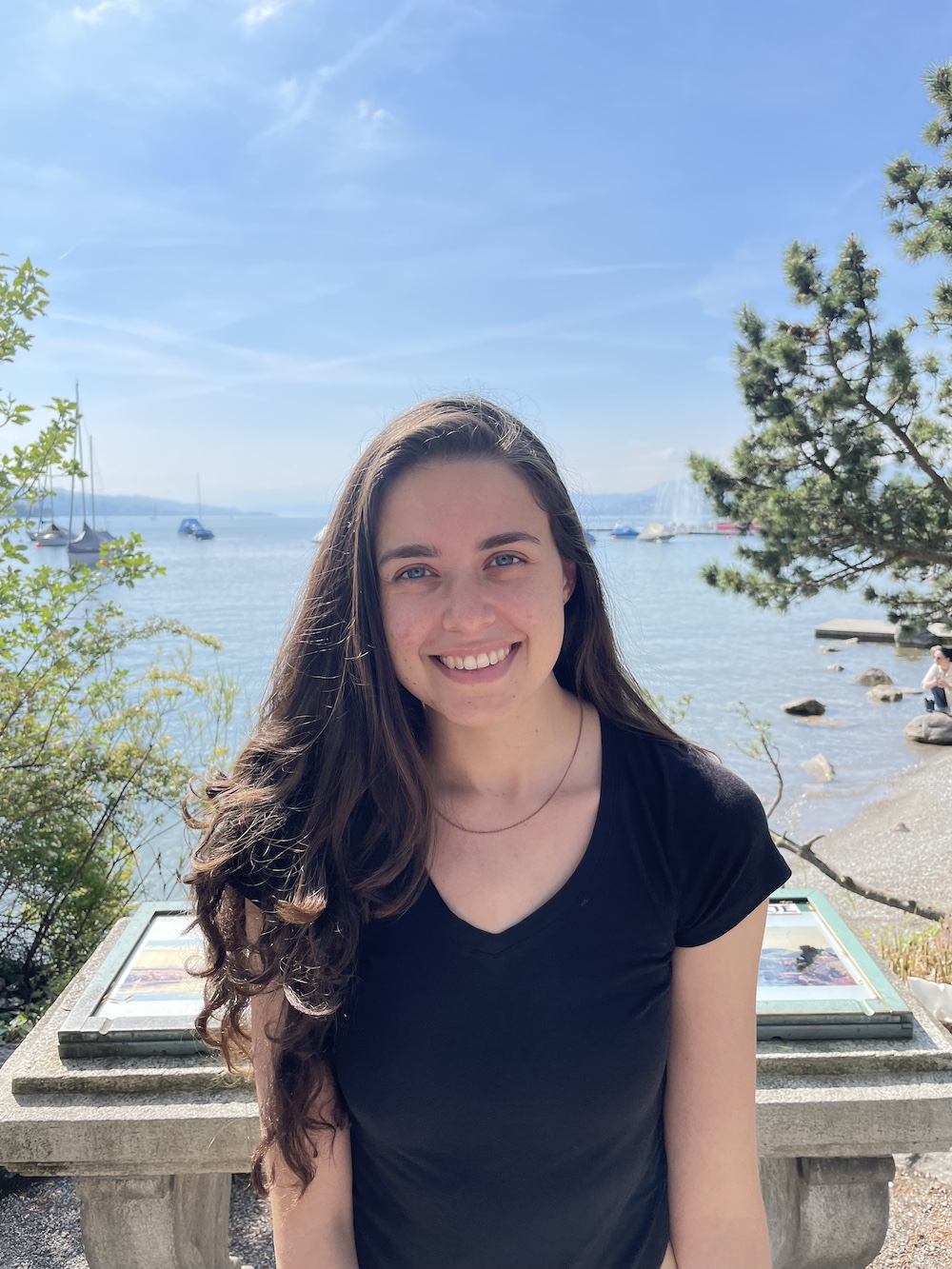 Picture of me next to a harbor with sailboats